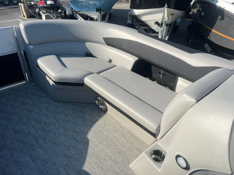Slide: The Image of 2024 Berkshire 24RFX LE 2.75 boat interior with gray seating and carpeted flooring. - 10