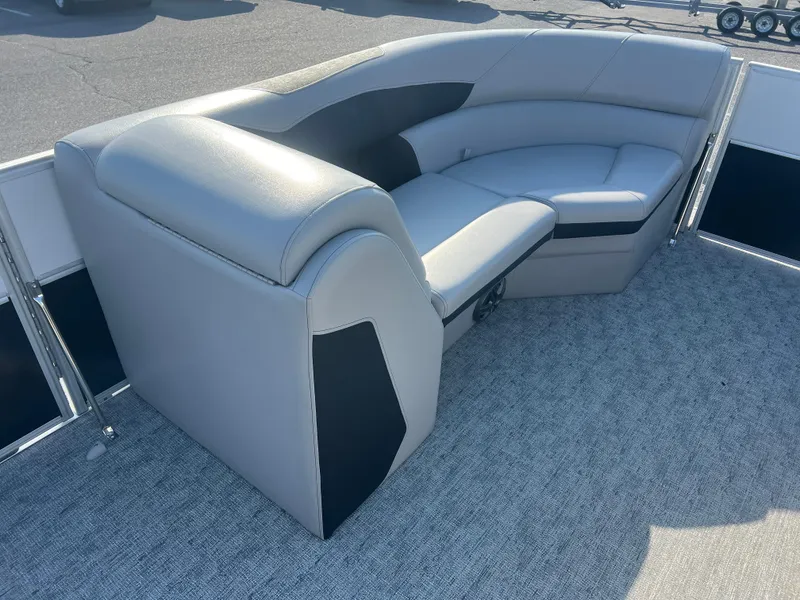 Slide: The Image of 2024 Berkshire 24RFX LE 2.75 pontoon boat with gray seating and carpeted deck. - 11