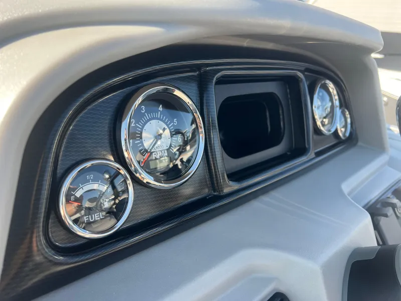 Slide: The Image of Dashboard of 2024 Berkshire 24RFX LE 2.75 with fuel and RPM gauges. - 14