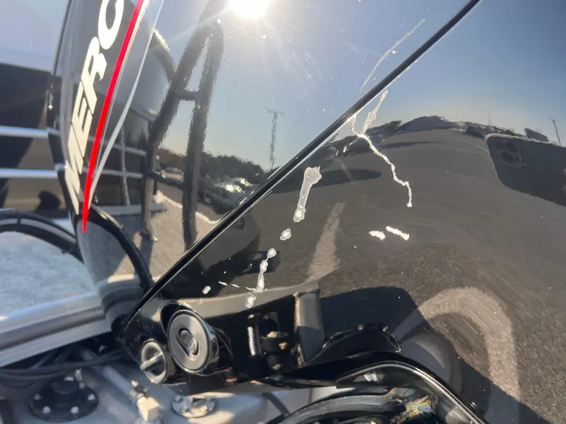 Slide: The Image of Close-up of a 2024 Berkshire 24RFX LE 2.75 boat engine with visible scratches. - 16
