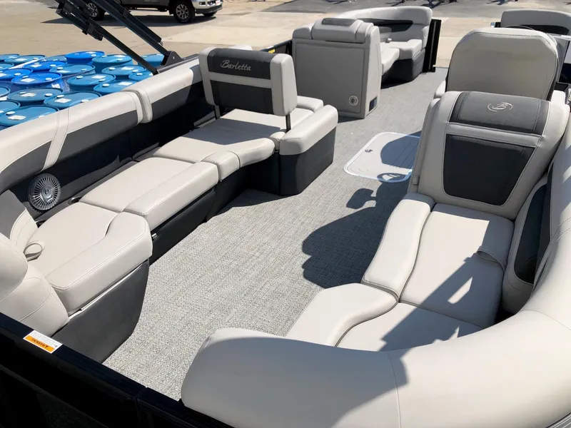 Slide: The Image of 2025 Barletta Cabrio 22QC pontoon boat with spacious seating and modern design. - 4