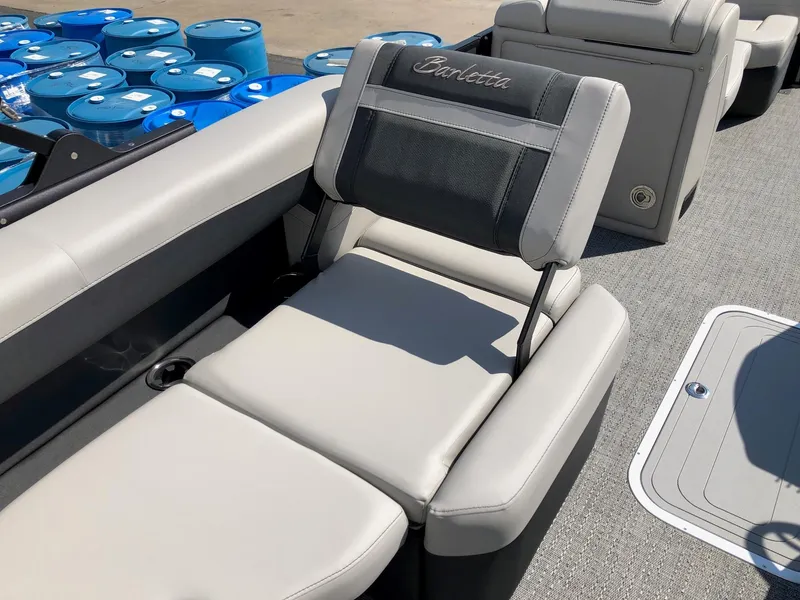 Slide: The Image of 2025 Barletta Cabrio 22QC boat interior with comfortable seating and modern design. - 6