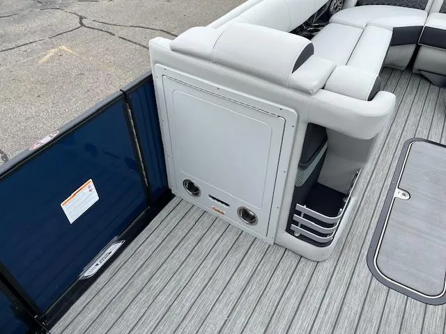 Slide: The Image of 2025 Harris Grand Mariner 250 boat interior with gray seating and flooring. - 11