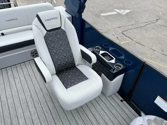 Slide: The Image of 2025 Harris Grand Mariner 250 boat interior with luxury seating and cup holders. - 13