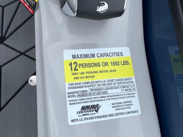 Slide: The Image of 2025 Harris Grand Mariner 250 capacity label: 12 persons or 1692 lbs, 400 HP motor. - 21