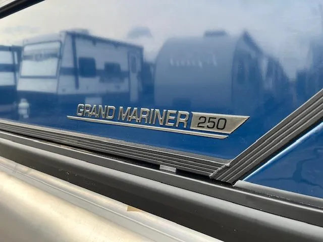 Slide: The Image of 2025 Harris Grand Mariner 250 logo on blue boat exterior. - 5