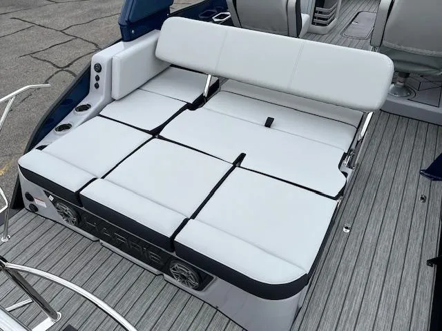 Slide: The Image of 2025 Harris Grand Mariner 250 boat with luxurious white seating and modern design. - 9