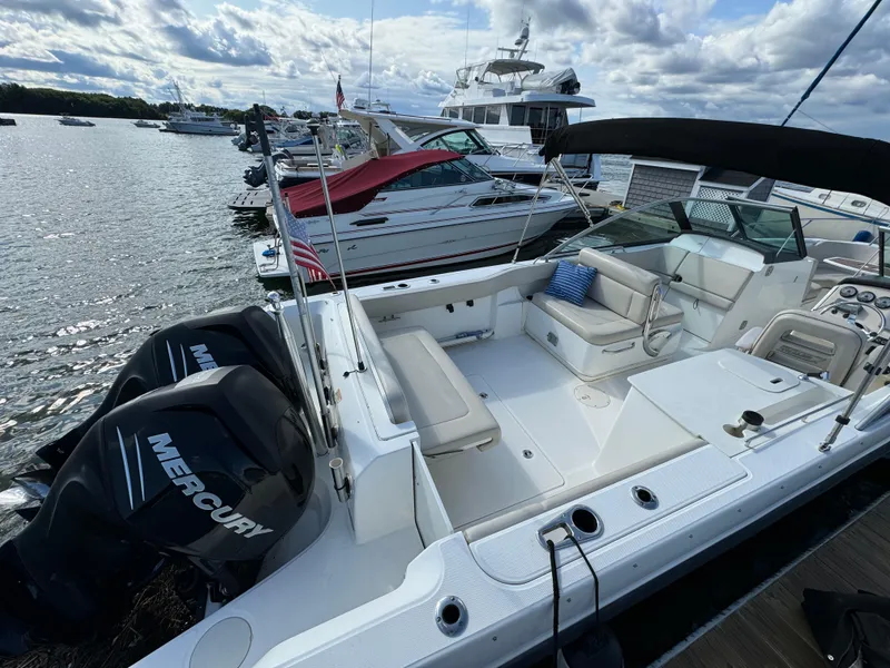 Slide: The Image of 2013 Boston Whaler 270 Vantage boat docked with Mercury engines. - 3