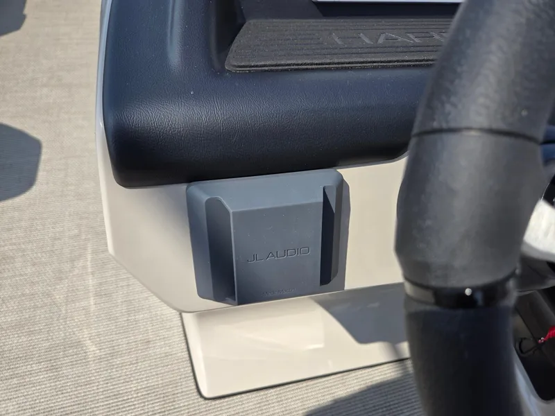 Slide: The Image of JL Audio speaker on 2025 Harris Cruiser 210 boat dashboard. - 13