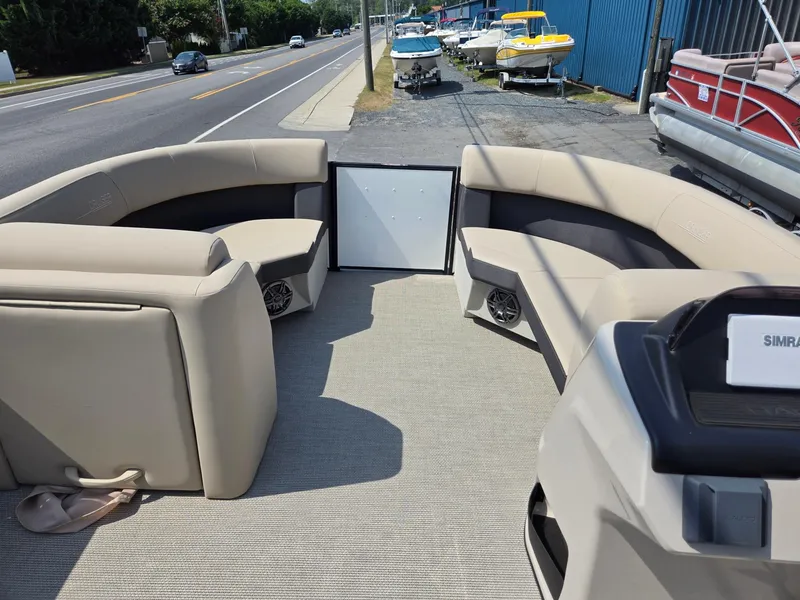 Slide: The Image of 2025 Harris Cruiser 210 pontoon boat interior with beige seating and modern design. - 26