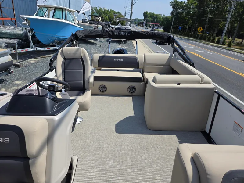 Slide: The Image of 2025 Harris Cruiser 210 pontoon boat interior with plush seating and modern design. - 6