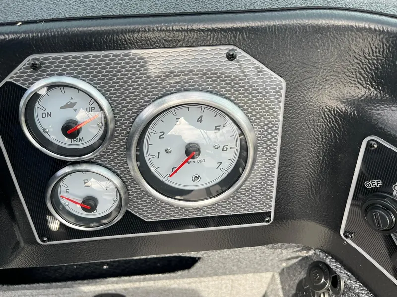 Slide: The Image of Dashboard gauges of 2025 Lund 1775 Impact XS Sport boat. - 19