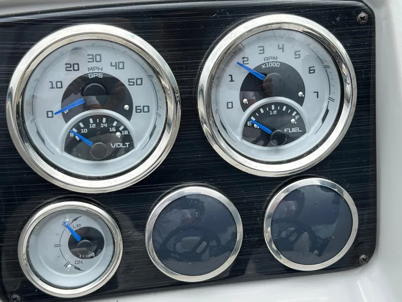 Slide: The Image of Dashboard gauges of 2023 Sylvan 8520 Party Fish boat, showing speed, RPM, and fuel levels. - 17