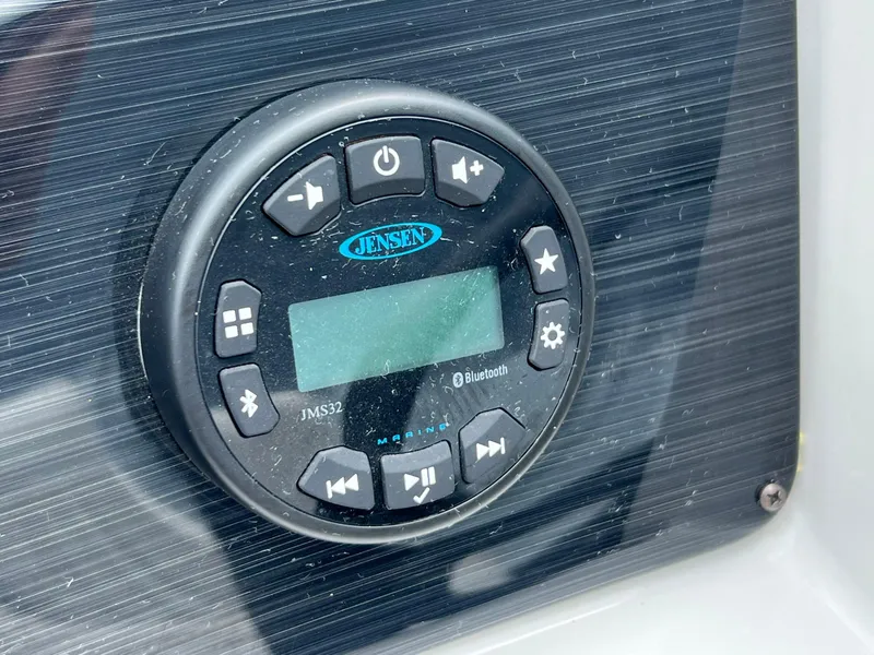 Slide: The Image of Jensen audio system on 2023 Sylvan 8520 Party Fish boat dashboard. - 18