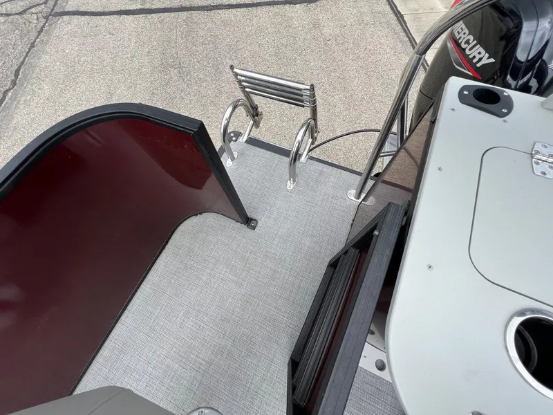 Slide: The Image of 2023 Sylvan 8520 Party Fish boat deck with ladder and Mercury engine. - 25