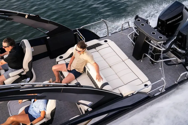 Slide: The Image of 2025 Barletta LUSSO 25UCAT luxury pontoon boat cruising on water. - 13