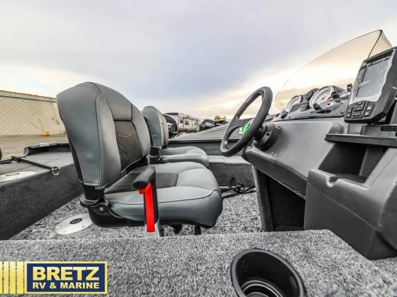 Slide: The Image of Interior of 2025 SUPER GUIDE V-16 SC boat with steering console and seating. - 10