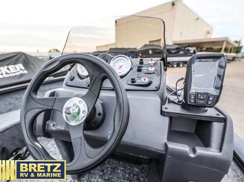 Slide: The Image of 2025 SUPER GUIDE V-16 SC boat dashboard with steering wheel and navigation system. - 11
