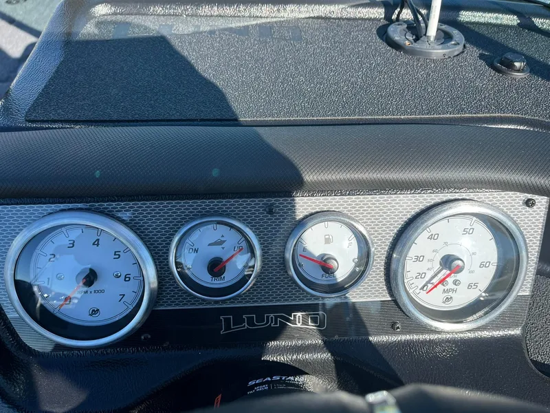 Slide: The Image of Dashboard of 2025 Lund 1875 Pro-V boat with gauges and controls. - 11