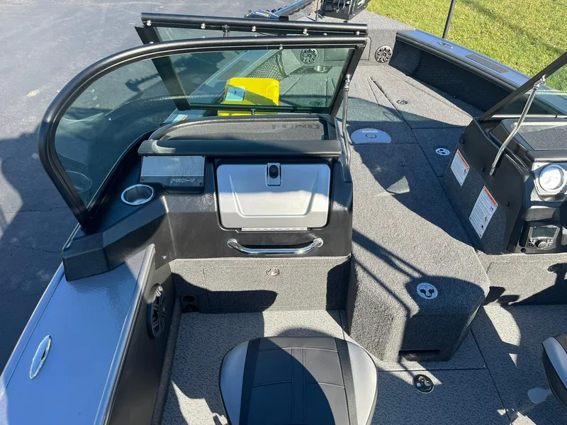 Slide: The Image of 2025 Lund 1875 Pro-V boat interior with seating and dashboard. - 16