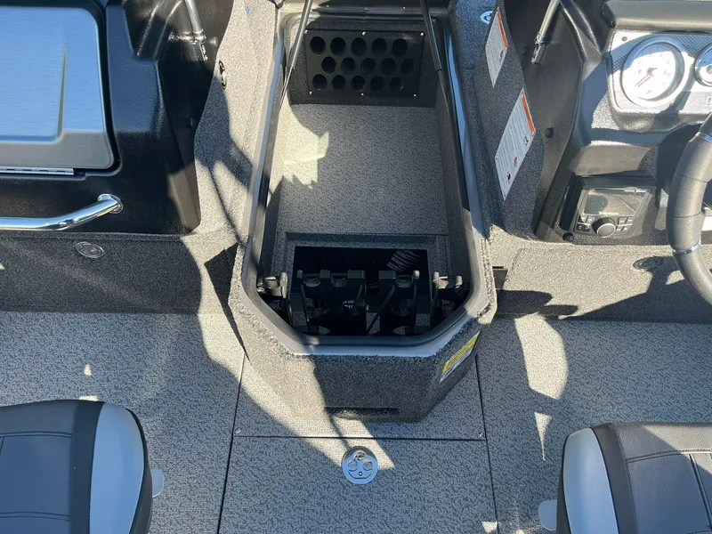 Slide: The Image of 2025 Lund 1875 Pro-V boat interior with storage compartment and seating. - 18