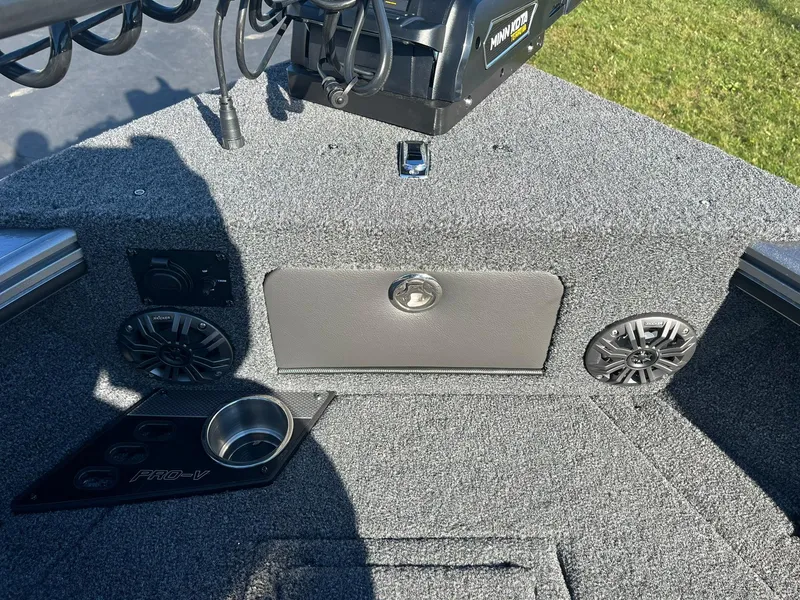 Slide: The Image of 2025 Lund 1875 Pro-V boat interior with speakers and cup holder. - 21