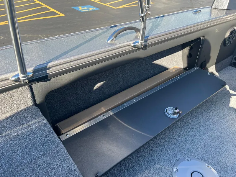 Slide: The Image of 2025 Lund 1875 Pro-V boat interior with storage compartment and sleek design. - 28