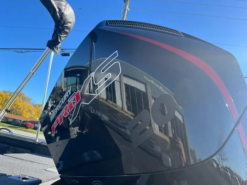 Slide: The Image of Close-up of 2025 Lund 1875 Pro-V boat engine with Pro XS branding. - 36