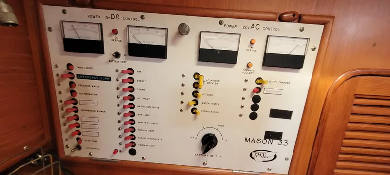 Slide: The Image of Electrical control panel of a 1985 Mason 33 Sloop sailboat with gauges and switches. - 20