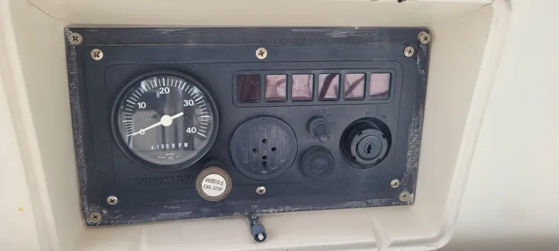 Slide: The Image of Control panel of a 1985 Mason 33 Sloop sailboat with gauges and switches. - 22