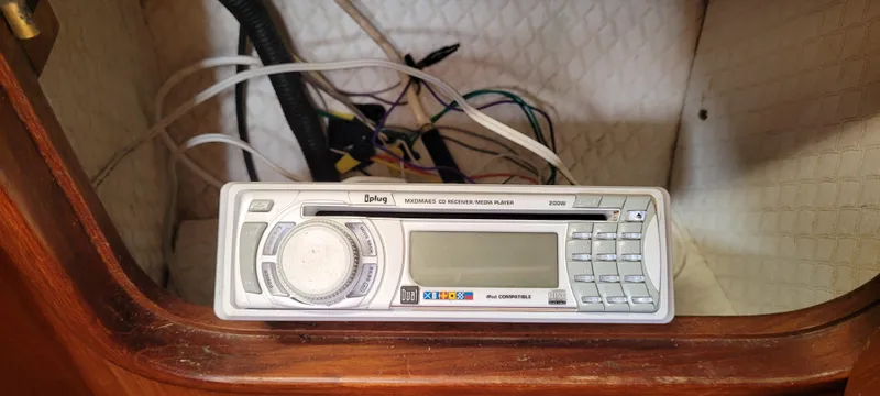 Slide: The Image of Vintage car stereo system inside a Mason 33 Sloop, 1985 model. - 24