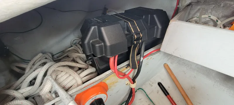 Slide: The Image of Battery compartment of a 1985 Mason 33 Sloop with cables and ropes. - 25