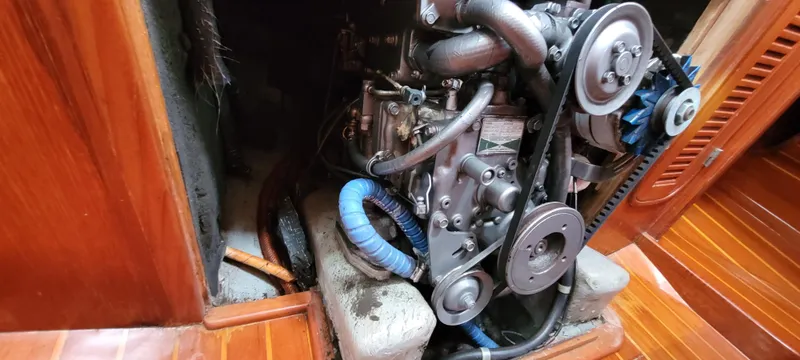 Slide: The Image of Engine compartment of a 1985 Mason 33 Sloop sailboat, showcasing mechanical components. - 30