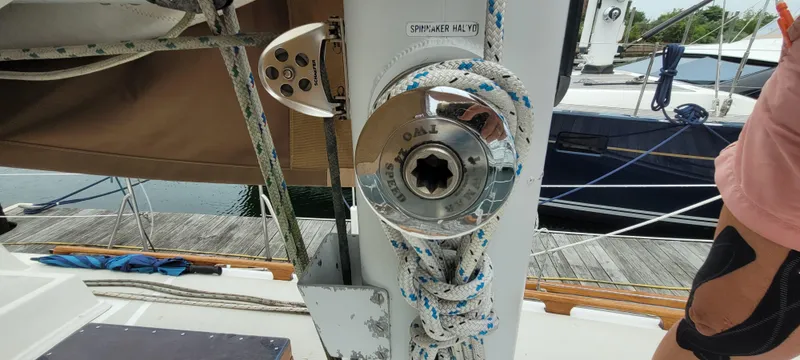 Slide: The Image of Mason 33 Sloop 1985 sailboat winch with ropes, docked at marina. - 34