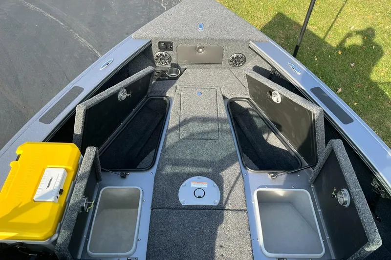 Slide: The Image of 2025 Lund 1875 Pro-V boat interior with open storage compartments. - 10