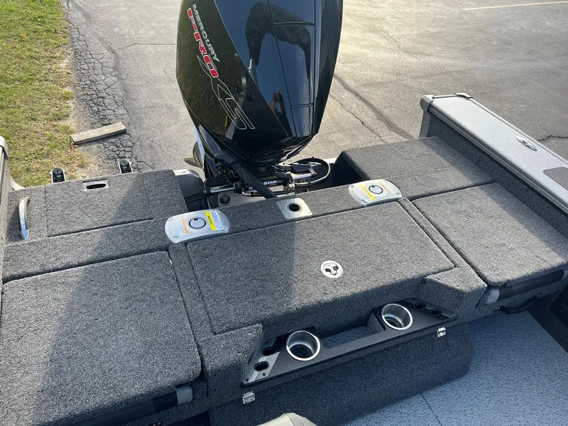 Slide: The Image of 2025 Lund 1875 Pro-V boat with outboard motor and carpeted deck. - 11