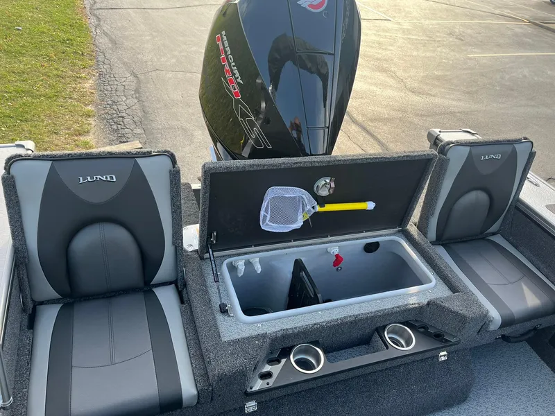 Slide: The Image of 2025 Lund 1875 Pro-V boat interior with storage compartment and seating. - 12