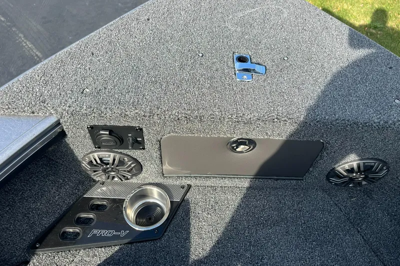 Slide: The Image of 2025 Lund 1875 Pro-V boat interior with speakers and cup holder. - 26