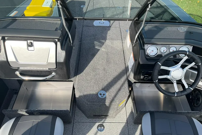 Slide: The Image of 2025 Lund 1875 Pro-V boat interior with steering wheel and dashboard. - 8