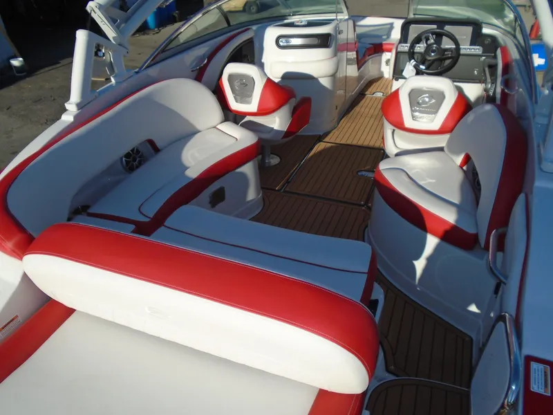 Slide: The Image of 2024 Crownline Eclipse E255 SURF boat interior with red and white seating. - 10