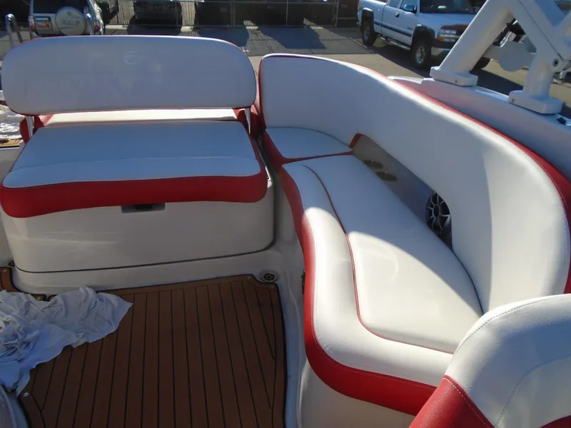 Slide: The Image of 2024 Crownline Eclipse E255 SURF boat interior with red and white seating. - 9