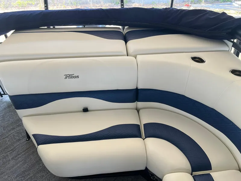 Slide: The Image of 2025 JC 21 NEPTOON TT Sport boat interior with blue and white seating. - 11