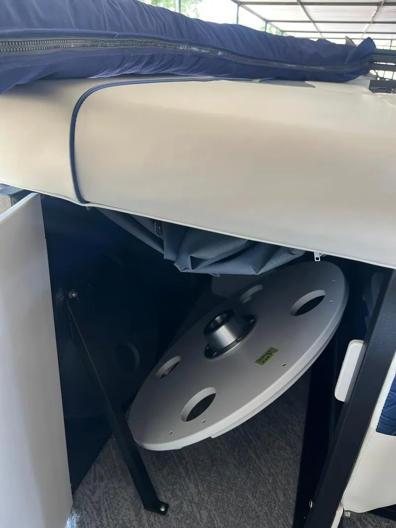 Slide: The Image of 2025 JC 21 NEPTOON TT Sport boat interior storage compartment with cover and reel. - 13