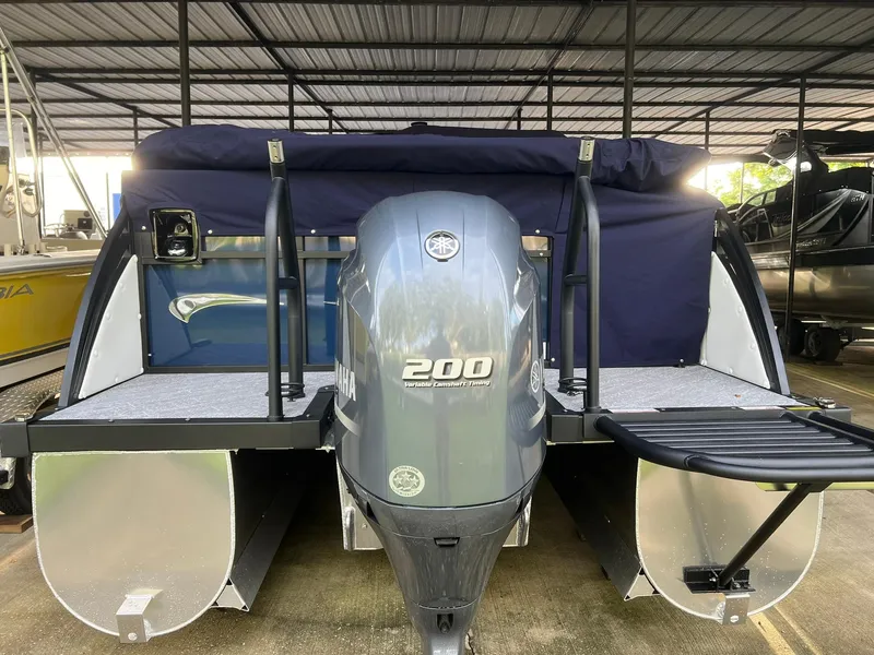 Slide: The Image of 2025 JC 21 NEPTOON TT Sport pontoon boat with Yamaha 200 engine in storage. - 3