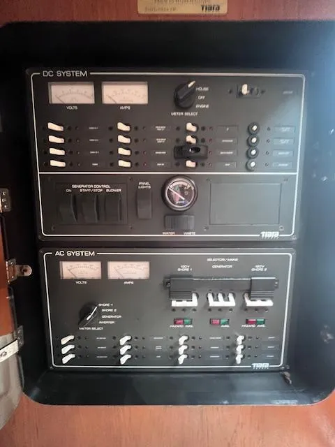 Slide: The Image of Electrical panel of 2001 Tiara Yachts 3500 Express, featuring DC and AC systems. - 21