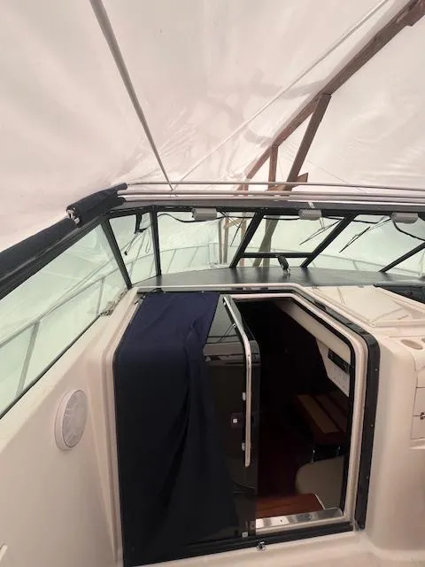 Slide: The Image of 2001 Tiara Yachts 3500 Express cabin entrance under protective cover. - 22