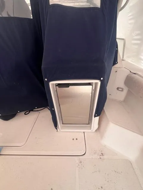 Slide: The Image of 2001 Tiara Yachts 3500 Express interior with covered equipment and seating area. - 27