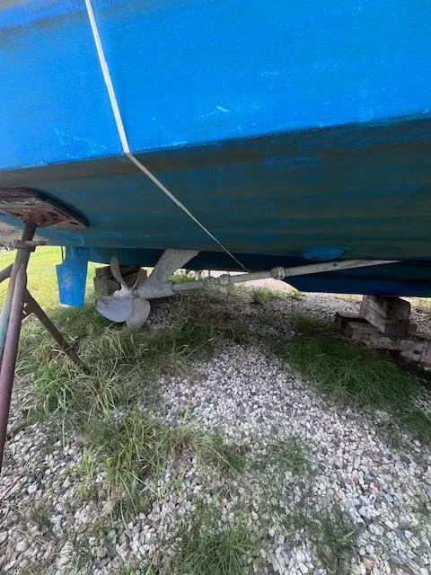 Slide: The Image of 2001 Tiara Yachts 3500 Express boat hull and propeller on dry land. - 30