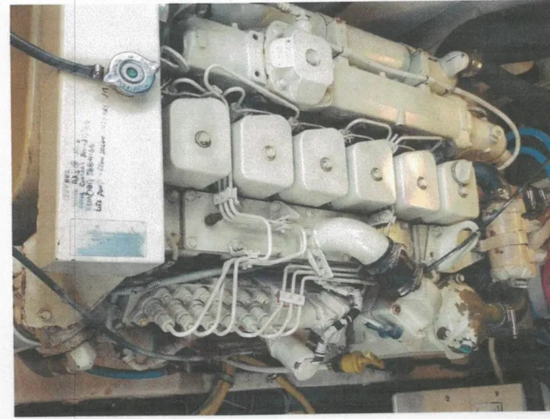 Slide: The Image of Engine of 2001 Tiara Yachts 3500 Express, showcasing mechanical components and wiring. - 33