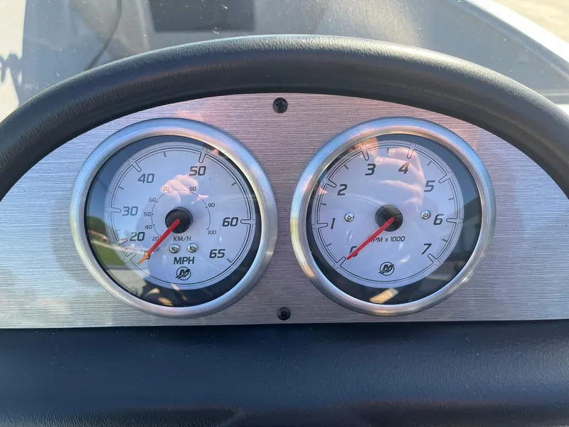 Slide: The Image of Dashboard of 2025 Lund 1600 Fury SS boat with speedometer and tachometer. - 10